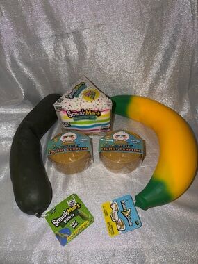 Squishy package, includes 2 mystery dumplings,  1  cake, 1 banana & 1 pickle